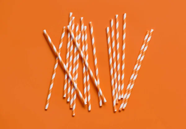 Striped Paper Drinking Straws Orange Background Top View Eco Friendly — Stock Photo, Image