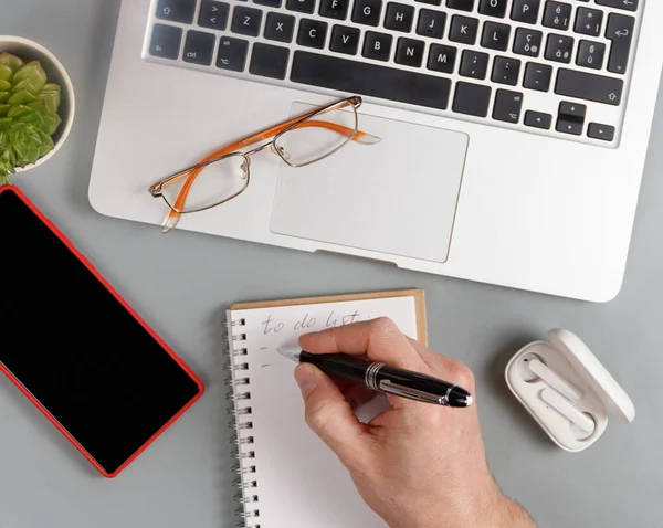 Man Writing List Agenda Grey Office Desk Top View Business — Stock Photo, Image