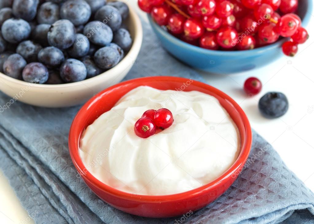 Healthy breakfast  -  Fresh berries with natural yogurt or sour 