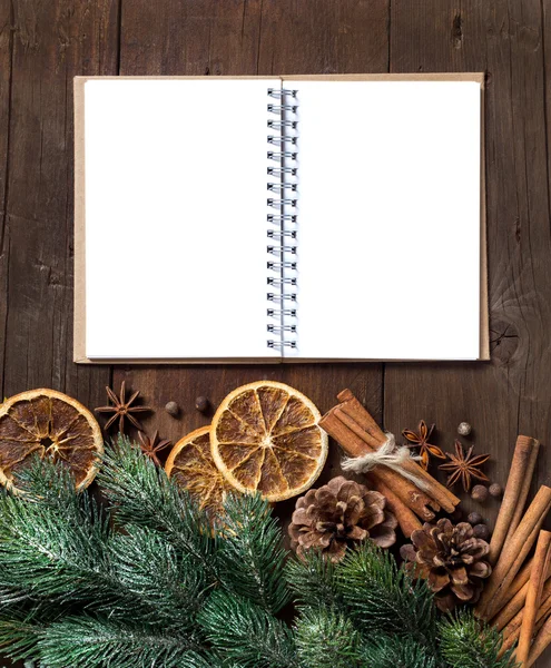 Christmas composition with spices and notebook — Stock Photo, Image