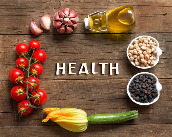 Vegetables and chickpea on a wooden table — Stock Photo, Image