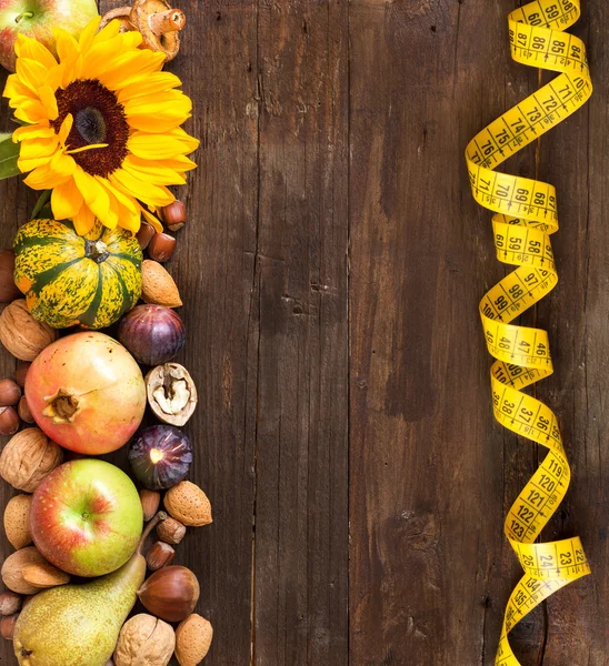 Autumn border on a wooden table — Stock Photo, Image