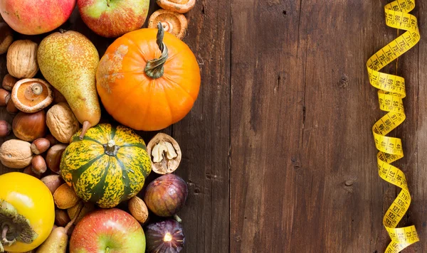 Autumn border on a wooden table — Stock Photo, Image