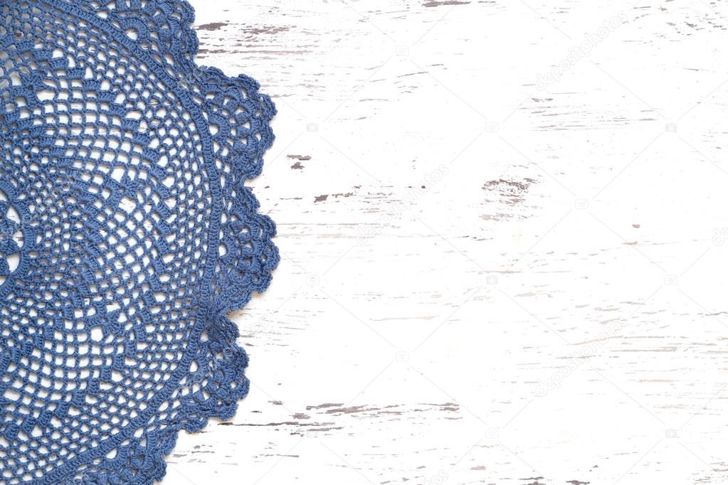 Crochet doily border over shabby chic wood
