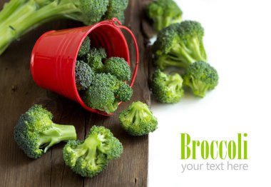 Fresh broccoli in red bucket clipart