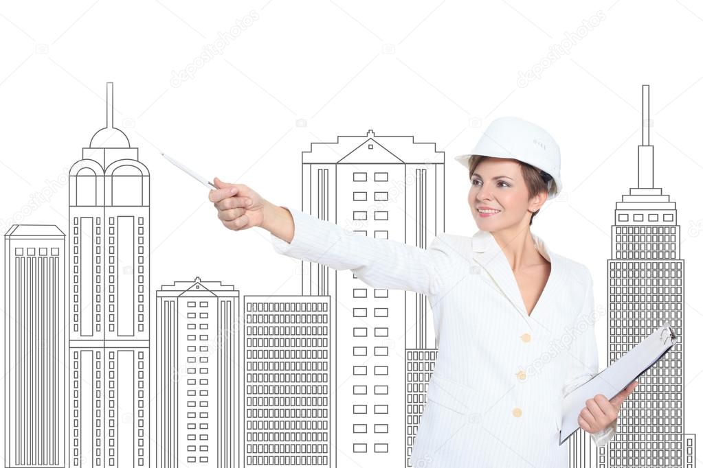 Smiling businesswoman in helmet studying the sketch of future business centre.