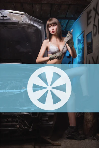 Icon car repairs on the background of a woman mechanic — Stock Photo, Image