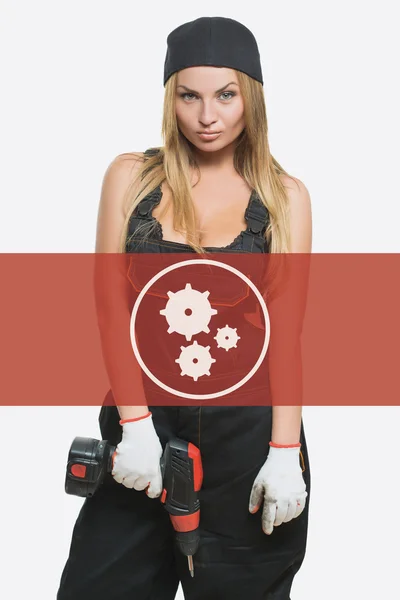 Sexy female holding a cordless screwdriver. Repair icon in the background woman. — Φωτογραφία Αρχείου