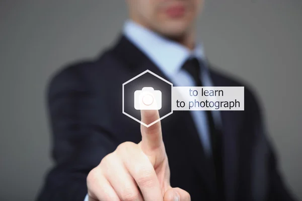 Close up of businessman touching camera icon on media screen — Stock fotografie