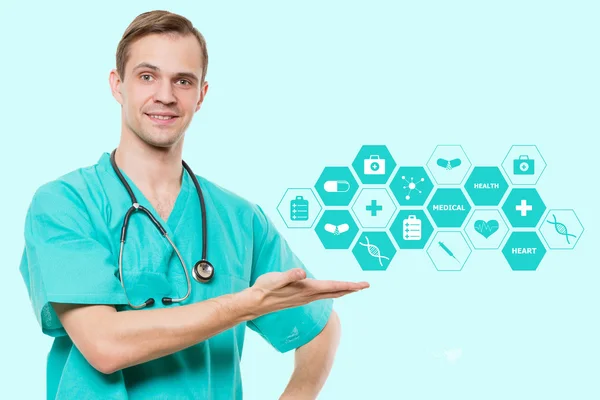 Healthcare, profession, symbols, people and medicine concept - smiling male doctor  in coat over blue background with medical icons — Stock Photo, Image