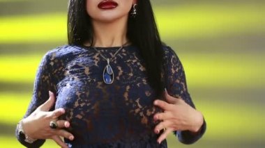 sexy woman touching her breast with hands