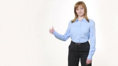 raised thumb. girl in pants and blous.  Isolated on white background. body language. women gestures. nonverbal cues