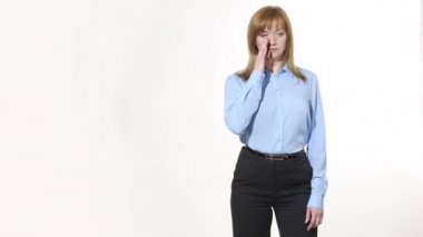 scratching his nose. lies gesture. girl in pants and blous.  Isolated on white background. body language. women gestures. nonverbal cues