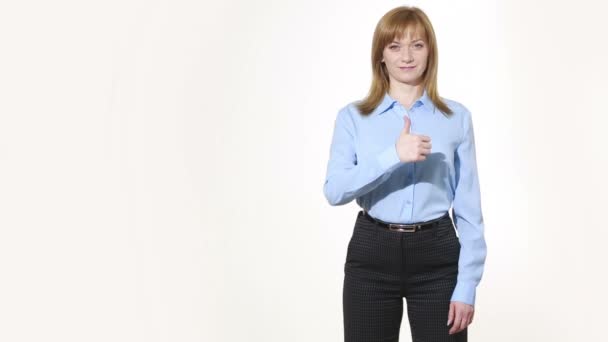 Raised thumb. girl in pants and blous.  Isolated on white background. body language. women gestures. nonverbal cues — Αρχείο Βίντεο