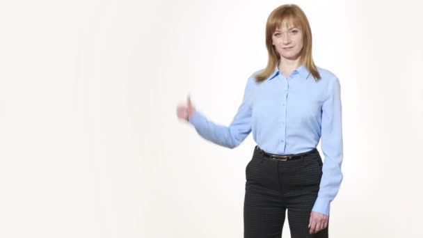 Raised thumb. girl in pants and blous.  Isolated on white background. body language. women gestures. nonverbal cues — Stok video