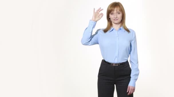 OK gesture. girl in pants and blous.  Isolated on white background. body language. women gestures. nonverbal cues — Stock video