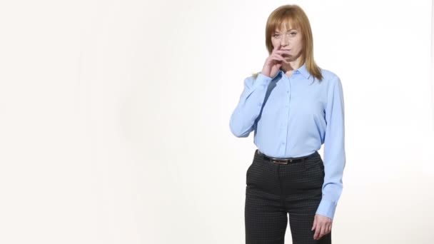 Scratching his nose. lies gesture. girl in pants and blous.  Isolated on white background. body language. women gestures. nonverbal cues — Wideo stockowe