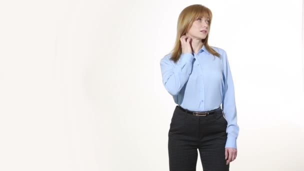 Rubbing neck. gesture of discontent. girl in pants and blous.  Isolated on white background. body language. women gestures. nonverbal cues — 图库视频影像