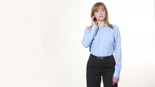 Touching the ear. lies gesture. girl in pants and blous.  Isolated on white background. body language. women gestures. nonverbal cues — Wideo stockowe