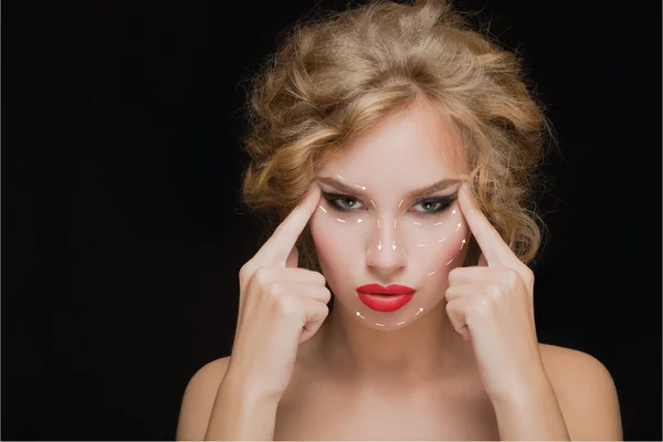 Portrait of young woman with arrows on her face — Stock Photo, Image