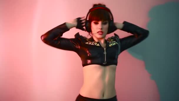 Hot beautiful girl like a dj. woman dancing with headphones — Stock Video