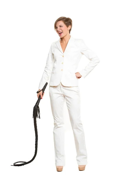 Business woman with a whip in her hands. — Stock Photo, Image