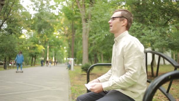 Young man holding handkerchief on nose. a man has a bad cold — Stok video