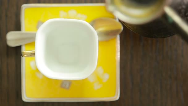 Coffee is poured into the mug. view from above. hot drink — Stock Video