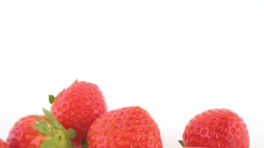 close-up. peach, strawberry and butt plug isolated on white background