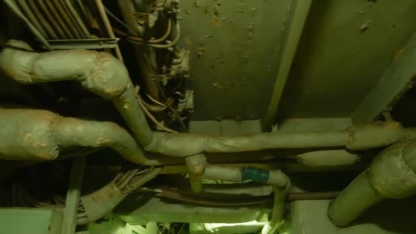 Pipes and wires in the corridor on the ceiling inside the warship — Stock Video