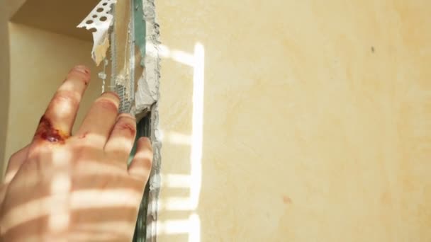 Close-up. work injury. Repairman man injured his finger during apartment renovation — Stock Video