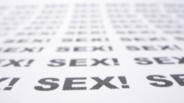 Extremely close-up, detailed. the word sex written many times on a white  piece of paper â€” Stock Video Â© kopitin #442413780