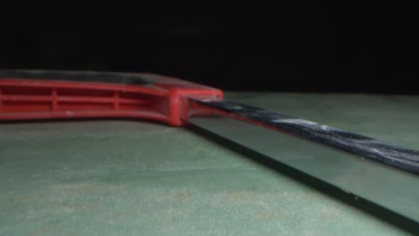 Extremely close-up, detailed. hacksaw on a dark background — Stock Video