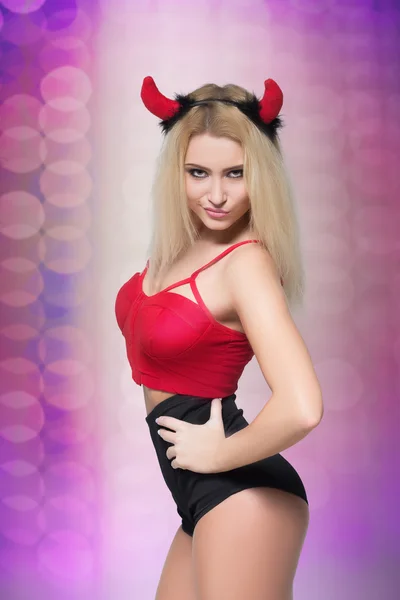 Female go go dancer.  girl wearing devil horns — Stock Photo, Image