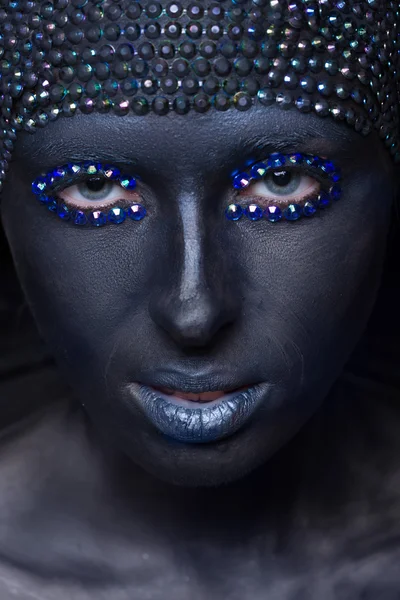 Portrait of a woman in black paint — Stock Photo, Image