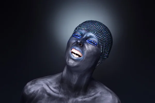 Portrait of a woman in black paint — Stock Photo, Image