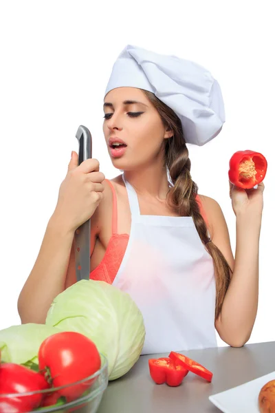 Ženské šéfkuchař drží nůž s výrazem — Stock fotografie