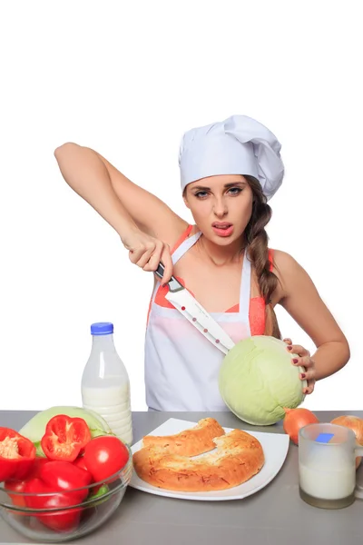 Chef mujer sosteniendo un cuchillo con expresión —  Fotos de Stock