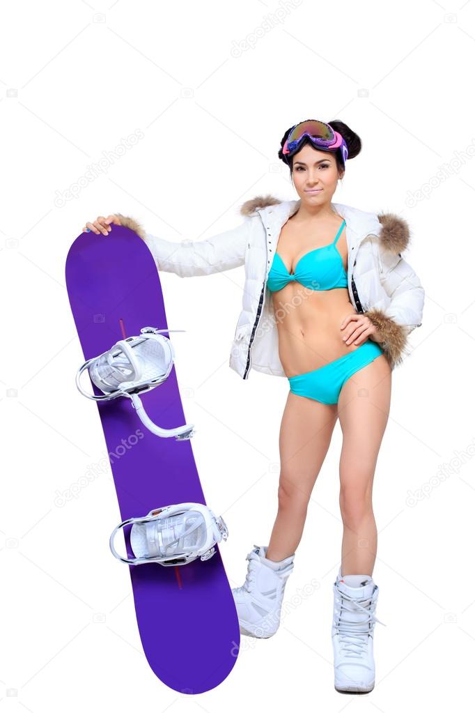 Sexy dressed woman with snowboard