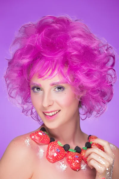 Girl with pink hair. a necklace of candy — Stock Photo, Image