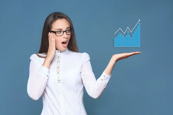 Business woman holding an rising arrow graph — Stock Photo, Image