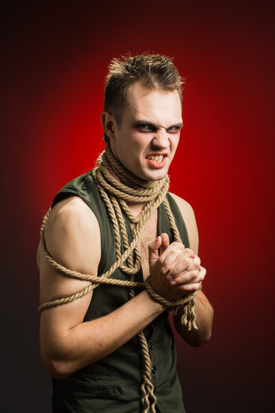 angry man with a rope around his neck