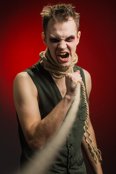 angry man with a rope around his neck