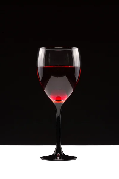 Still-life with the wine glass on black — Stock Photo, Image