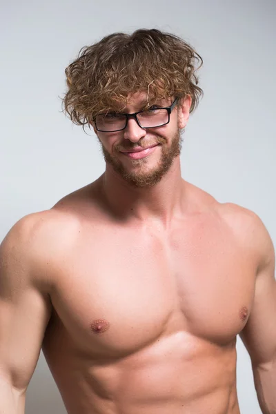 Sexy muscular male model wearing in glasses — Stock Photo, Image