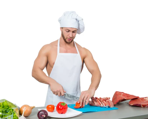 男性健美厨师切番茄. — 图库照片