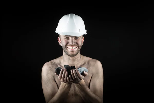 Mijnwerker op een zwarte achtergrond — Stockfoto