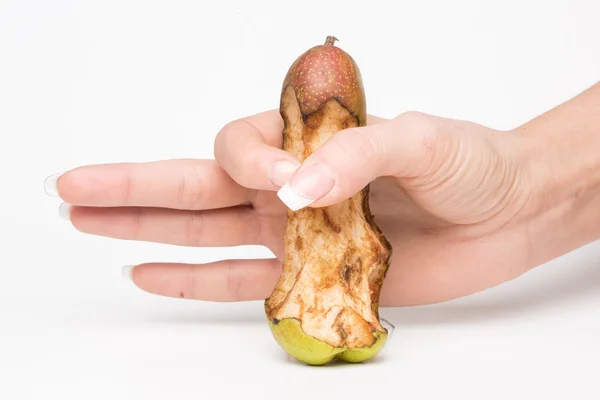 Female hand holding a pear-like penis — Stock Photo, Image