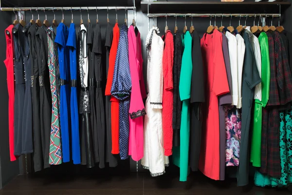 Womens dresses on hangers in a retail shop — Stock Photo, Image