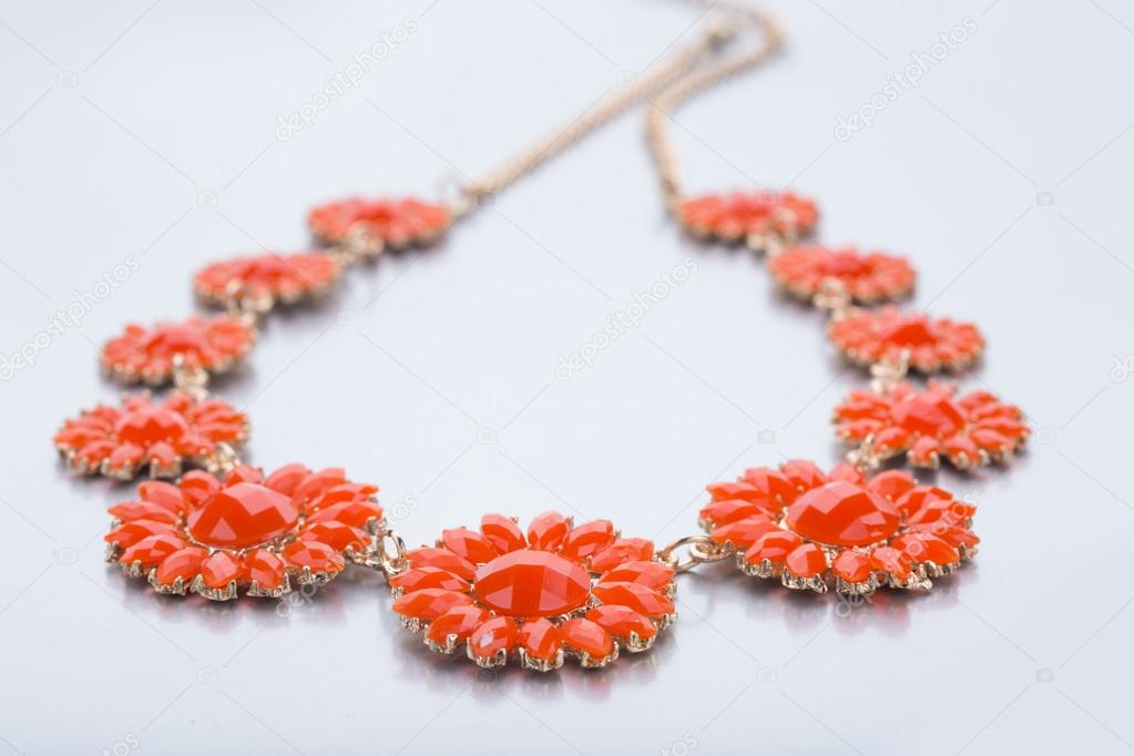 plastic necklace. five beige flower